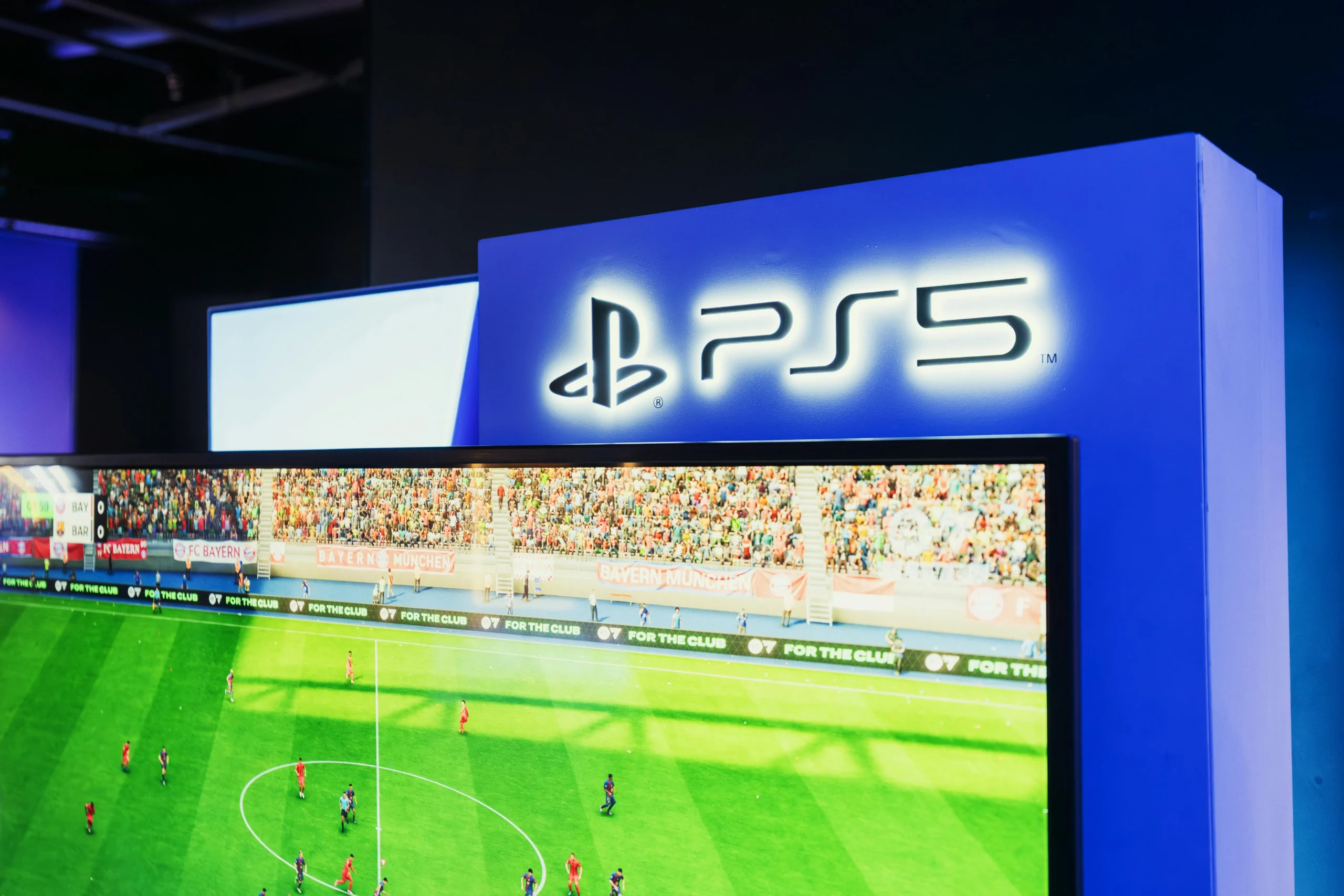 Playing a PlayStation 5 football game on a big screen